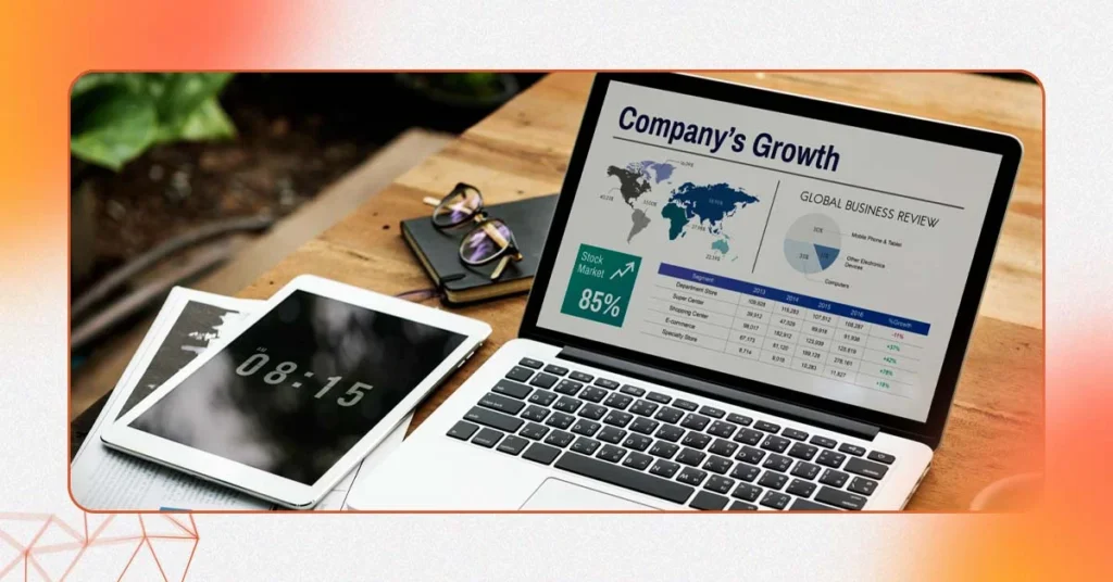 A professional desk setup where a digital marketing specialist analyzes business growth charts on a laptop, symbolizing a strategic consultation for an e-commerce digital marketing agency.