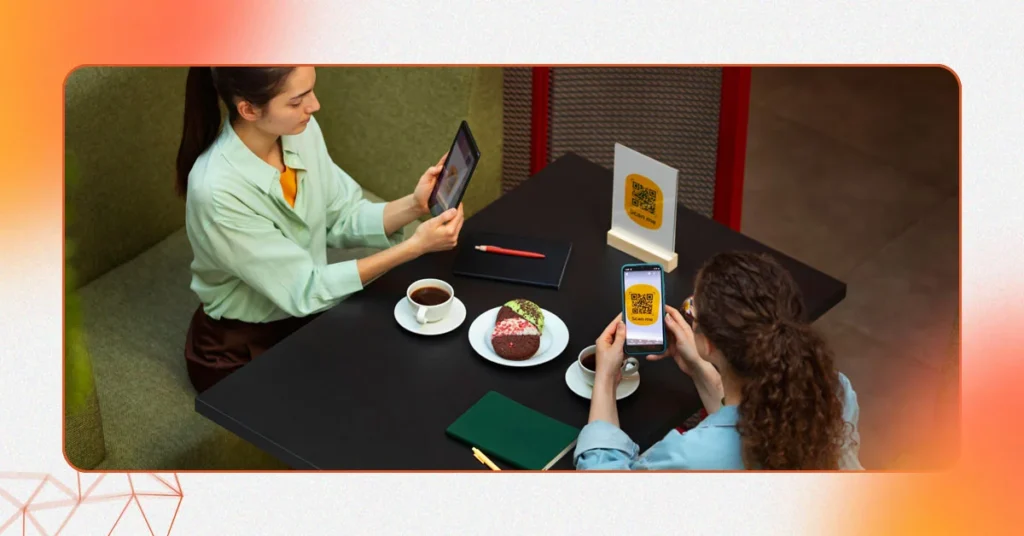 Patrons in a modern restaurant browsing digital menus and ordering food via tablet and smartphone, highlighting the tech-enabled operations of a prime restaurant-for-sale-in-Dubai.